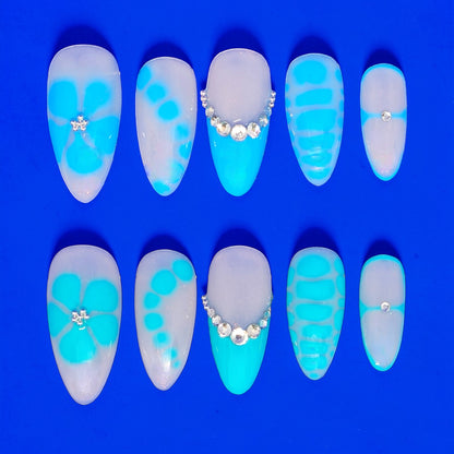 Auntie Cookies Nails Aqua Lagoon press on nails with milky base, aqua accents, and crystal details.