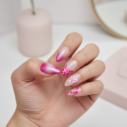 Auntie Cookies Nails Blush Bloom press on nails feature pink and fuchsia gradient, floral 3D accents, rhinestones, and glitter. Almond shape.