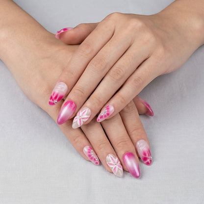 Auntie Cookies Nails: Pink gradient almond press-on nails with 3D flowers and rhinestones. Romantic, sparkly design.