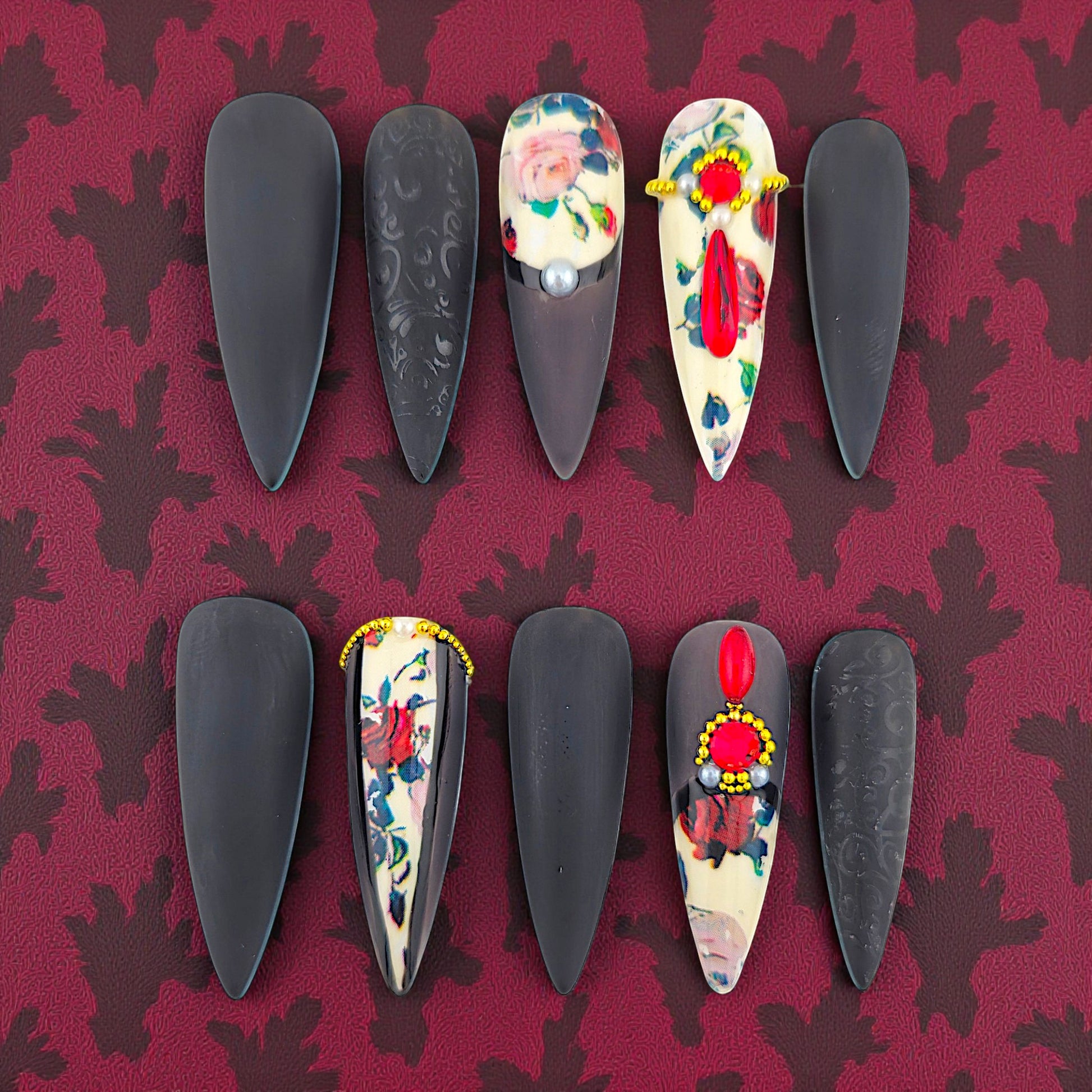 Auntie Cookies Nails dark coquette press-on nails with floral and jewel accents, almond shape.