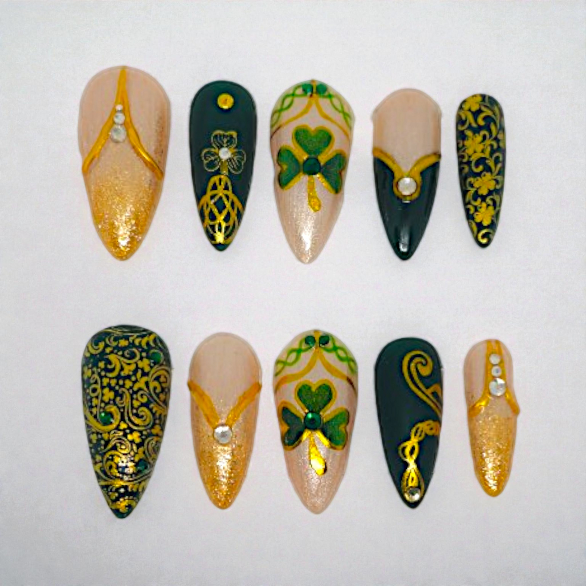 Auntie Cookies Nails Gaelic Glam press on nails: emerald green, champagne shimmer, gold accents, Celtic knot, clover, rhinestones.