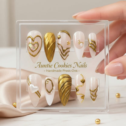 Auntie Cookies Nails opulent ivory press-on nails with gold accents and heart details. Set of 10.