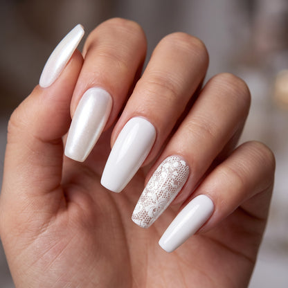 Auntie Cookies Nails ivory coffin press-on nails with pearlescent shimmer, solid gloss, and intricate lace accent design.