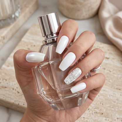 Auntie Cookies Nails ivory coffin press-on nails with pearlescent, glossy, and intricate lace accent designs.