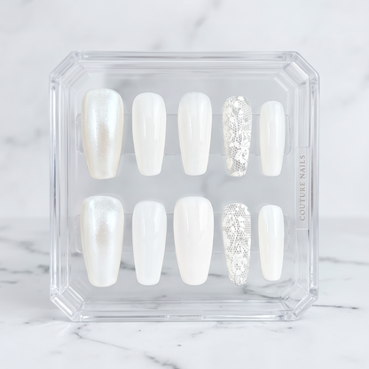 Auntie Cookies Nails ivory coffin press-on nails featuring pearlescent, glossy, and intricate lace accent designs.