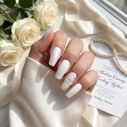 Auntie Cookies Nails ivory coffin press-on nails with pearlescent, solid gloss, and intricate lace accent designs.