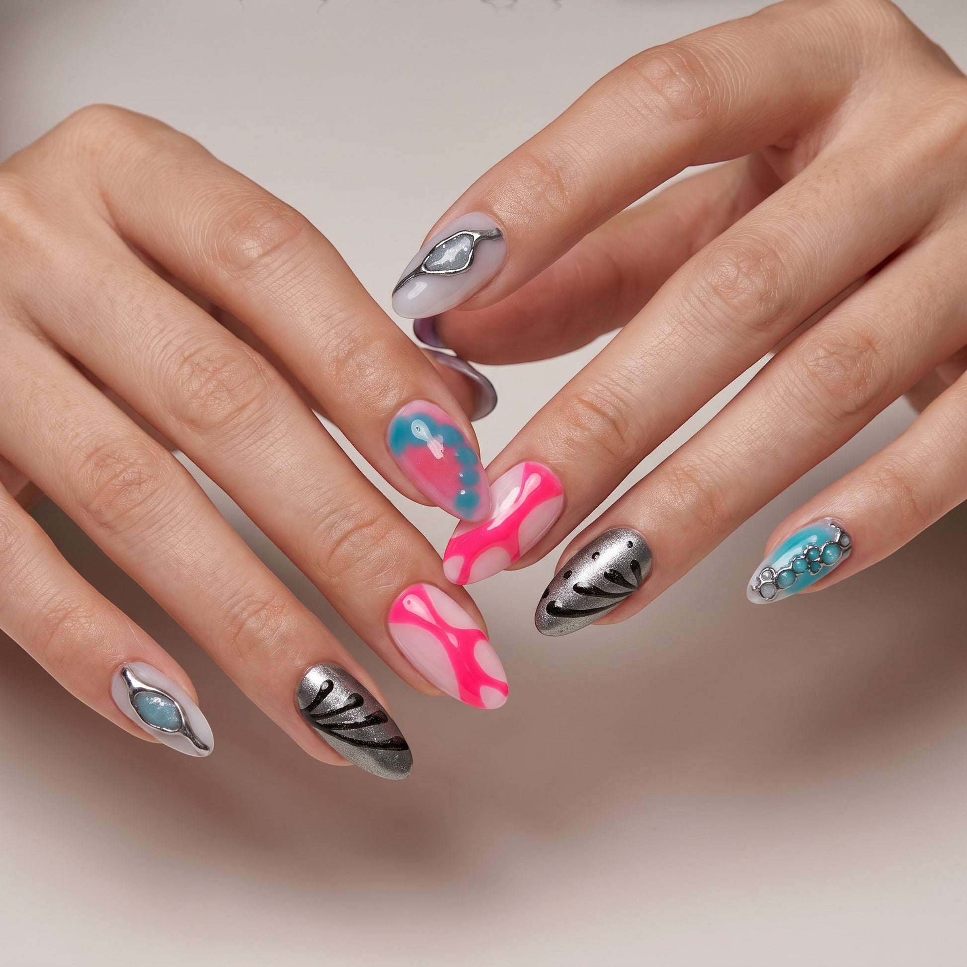 Auntie Cookies Nails Neon Aura press-on nails with neon pink, electric blue, and metallic silver 3D abstract designs.