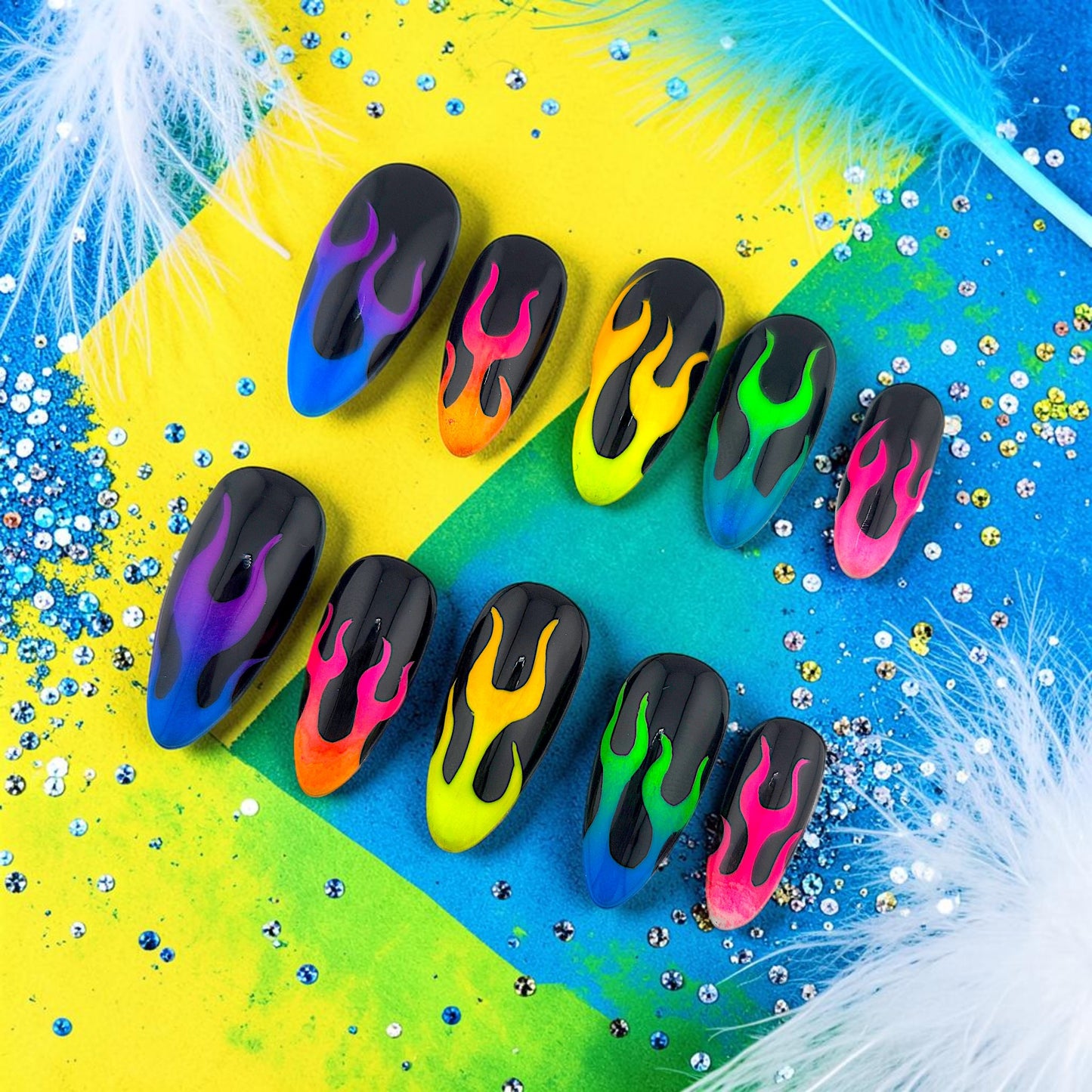 Auntie Cookies Nails almond press-on nails with black base and vibrant neon gradient flame designs.