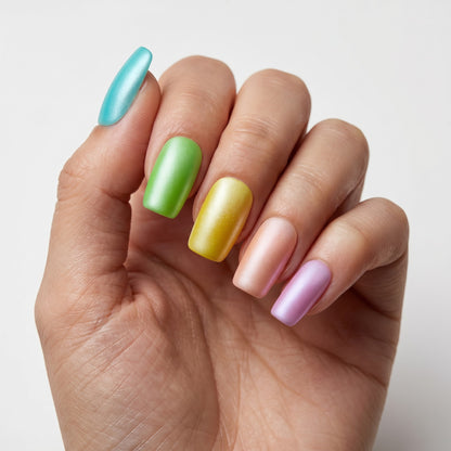 Auntie Cookies Nails pastel press on nails in teal, green, yellow, peach, and lavender with a matte finish.