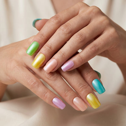 Auntie Cookies Nails pastel press on nails in matte finish, featuring green, yellow, peach, lavender, and teal.