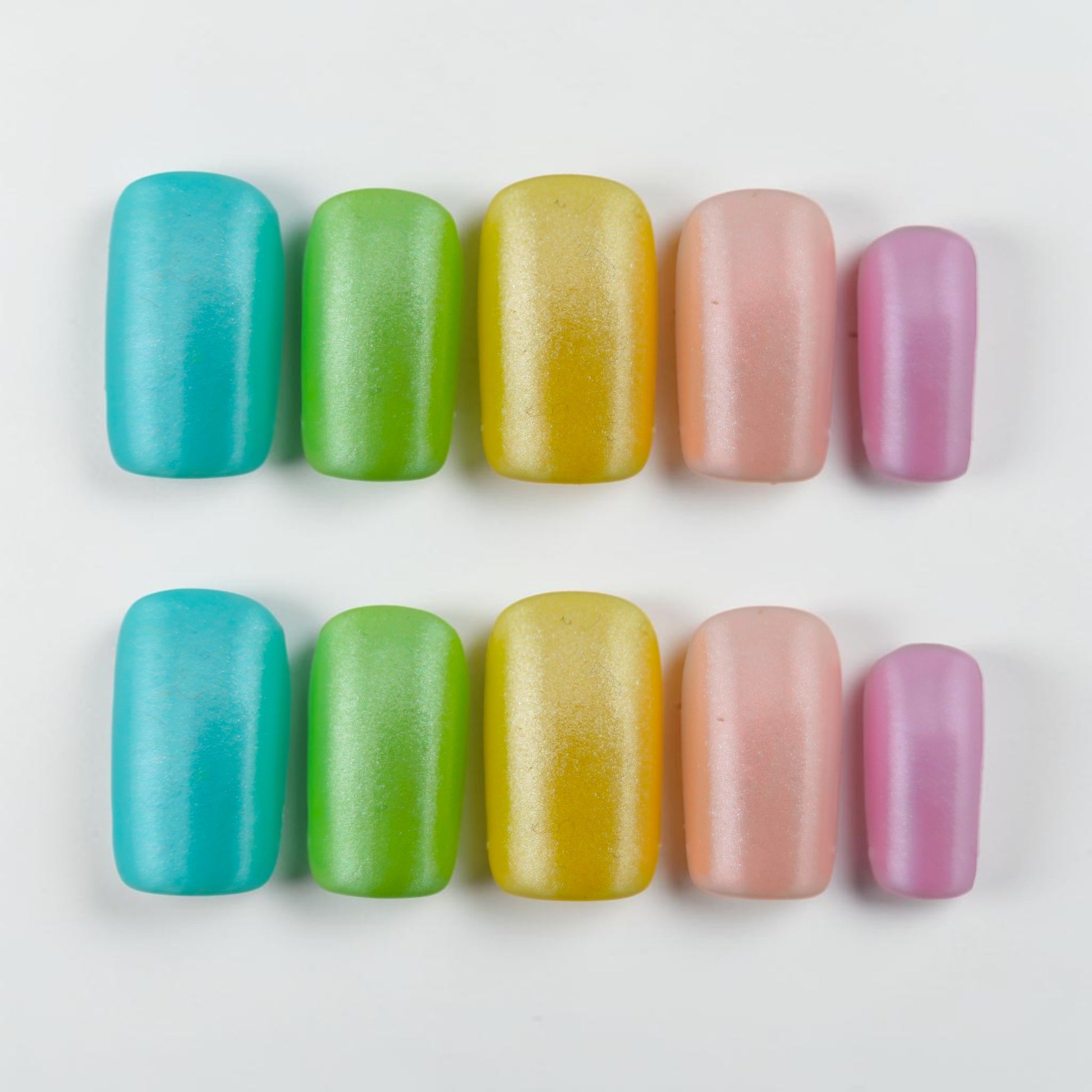 Auntie Cookies Nails pastel press on nails in teal, lime green, yellow, pink, and lavender with a matte finish.