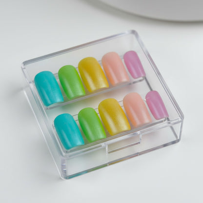Auntie Cookies Nails pastel press on nails in teal, lime green, yellow, pink, and lavender with a matte finish.