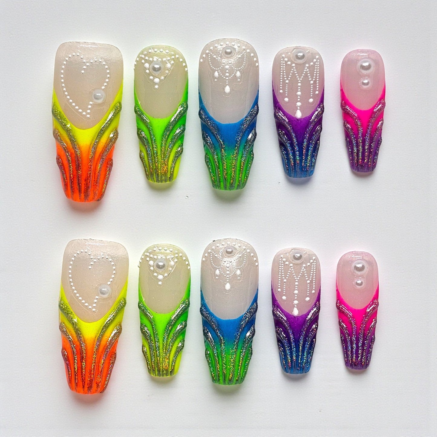 Auntie Cookies Nails: Set of 10 rainbow gradient press-on nails with glitter, pearl, and bead accents.