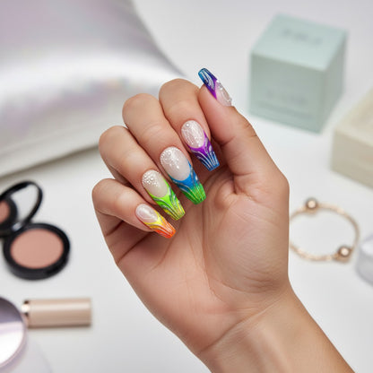 Auntie Cookies Nails: Set of 10 press-on nails with vibrant rainbow gradient, glitter, white bead, and pearl accents. Coffin shape.