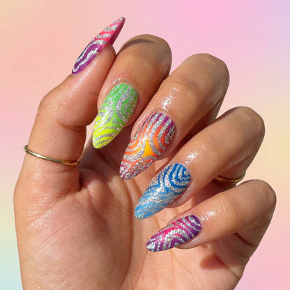 Auntie Cookies Nails Zebra Pop Parade press-on nails with rainbow gradient, silver glitter, and zebra print patterns.