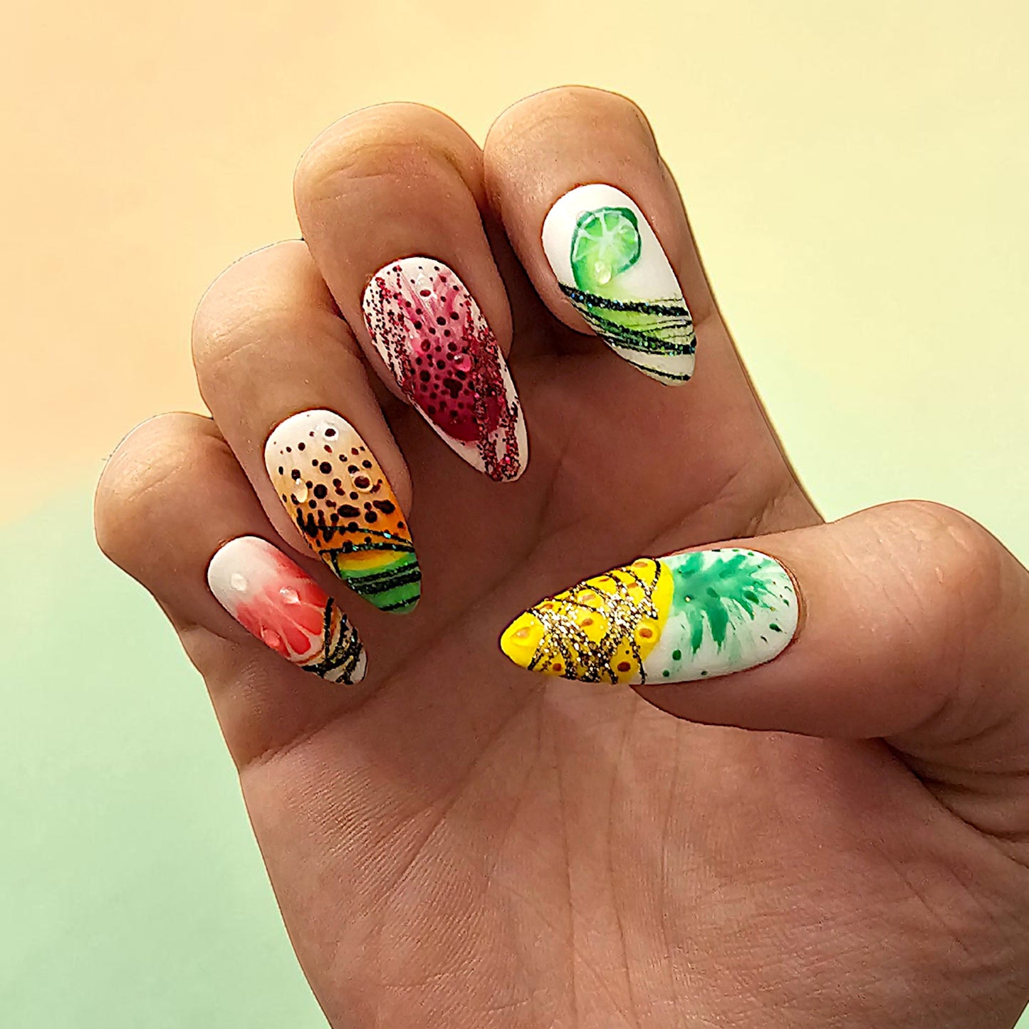 Auntie Cookies Nails: Vibrant press-on nails with tropical fruit designs like watermelon, pineapple, and lime, featuring glitter accents.
